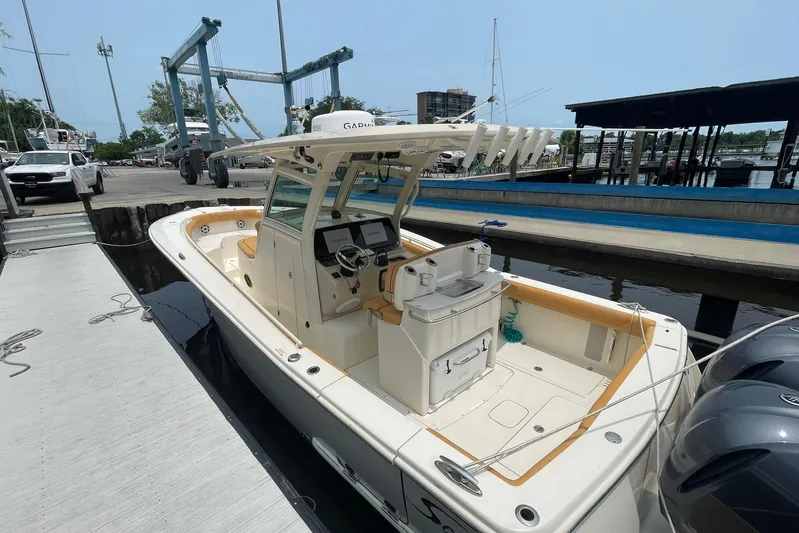  Yacht Photos Pics 2015 Scout 300 LXF boat docked at marina with dual engines.
