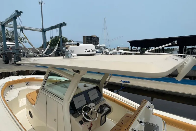  Yacht Photos Pics 2015 Scout 300 LXF boat with Garmin electronics at a marina dock.