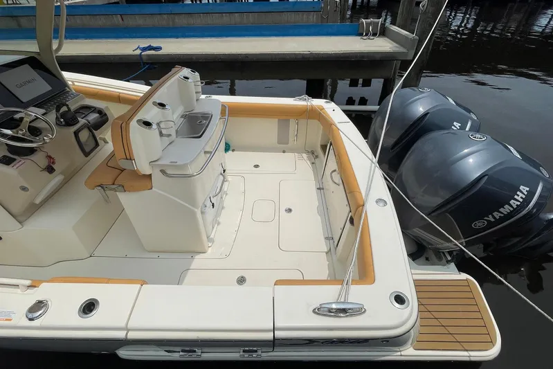  Yacht Photos Pics 2015 Scout 300 LXF boat with Yamaha engines, featuring a sleek deck and modern controls.