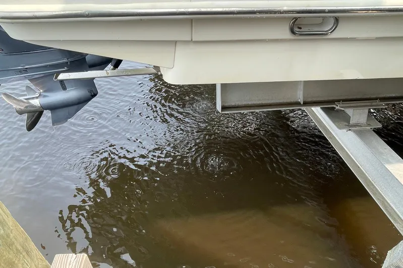  Yacht Photos Pics 2015 Scout 300 LXF boat on trailer with visible outboard motor.