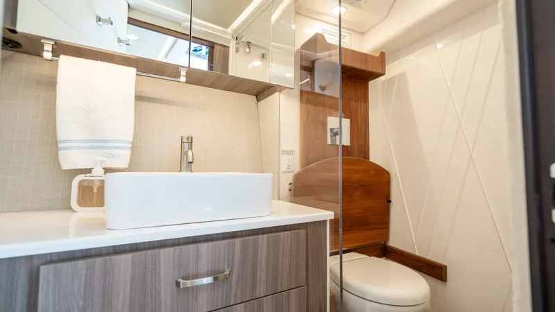  Yacht Photos Pics Modern bathroom interior in 2022 Regal 36 Grande Coupe yacht.