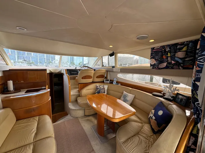 4 Aces Yacht Photos Pics Interior of 2001 Viking Princess 45 Flybridge yacht with luxurious seating and dining area.