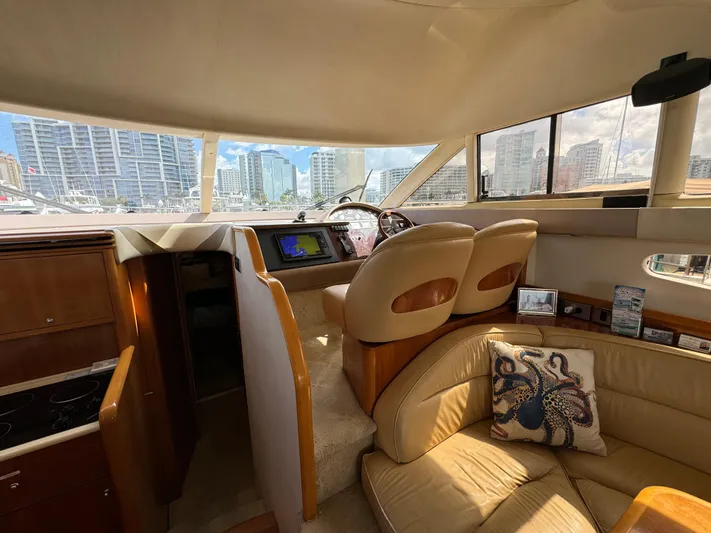 4 Aces Yacht Photos Pics Interior of 2001 Viking Princess 45 Flybridge yacht with city skyline view.