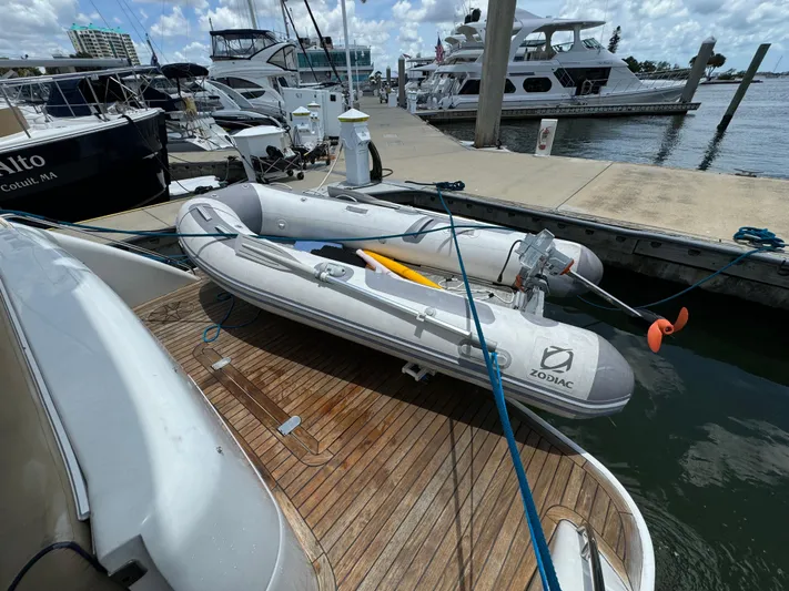 4 Aces Yacht Photos Pics Inflatable Zodiac boat on a 2001 Viking Princess 45 Flybridge yacht at a marina.