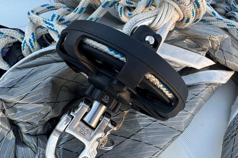 Victory Yacht Photos Pics Close-up of Jeanneau Sun Odyssey 479 sailing equipment, featuring ropes and a metal fitting.