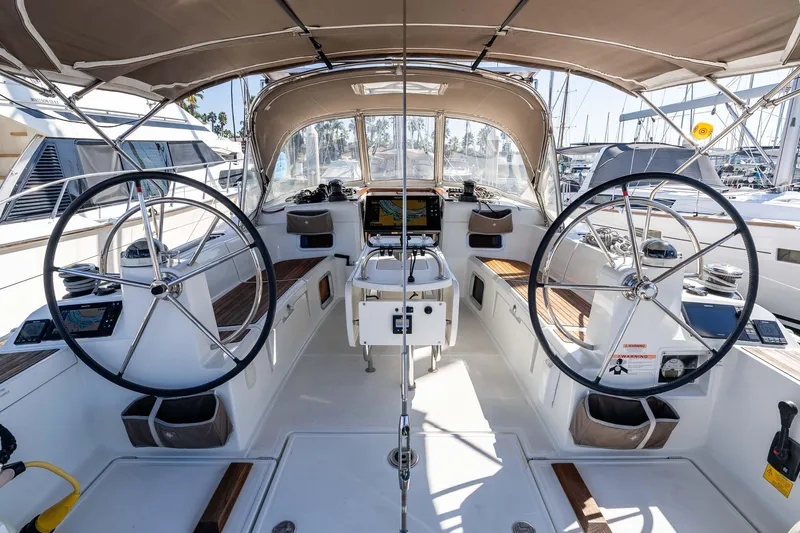 Victory Yacht Photos Pics 2018 Jeanneau Sun Odyssey 479 yacht cockpit with dual steering wheels and navigation equipment.