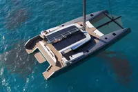 Luxury Black Pepper Code C69 catamaran sailing on clear blue water, 2027 model.