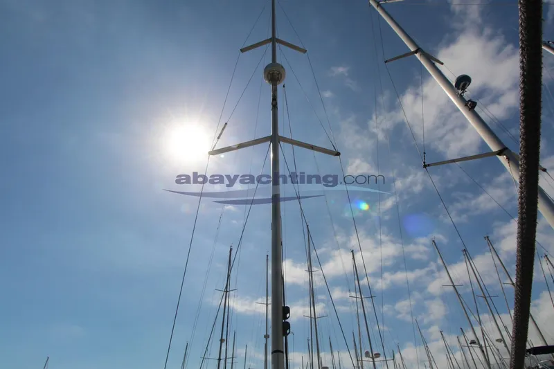  Yacht Photos Pics Mast of 2007 Beneteau Oceanis 43 sailboat against a bright, sunny sky.