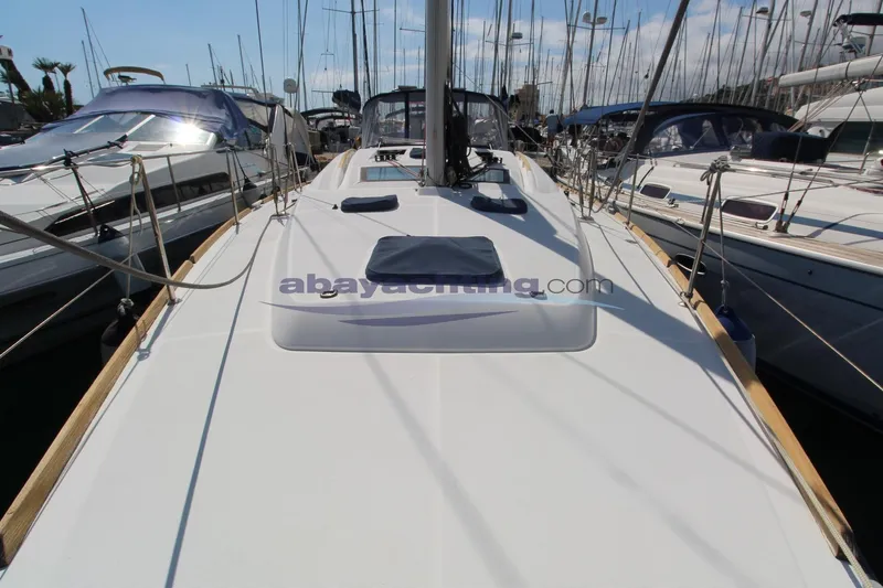  Yacht Photos Pics 2007 Beneteau Oceanis 43 sailboat docked in a marina, showcasing its sleek deck design.