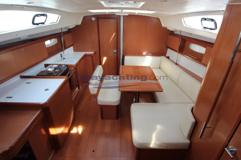  Yacht Photos Pics Interior of 2007 Beneteau Oceanis 43 yacht with kitchen and dining area.