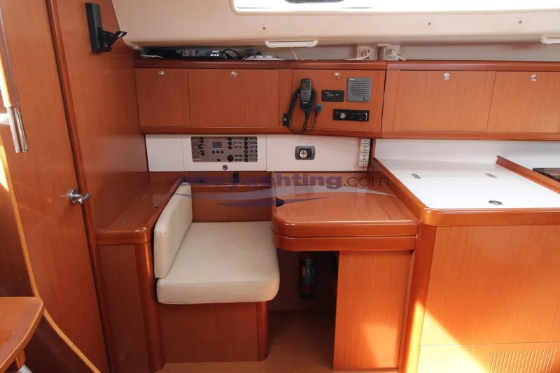  Yacht Photos Pics Interior of 2007 Beneteau Oceanis 43 yacht, featuring navigation station and wooden cabinetry.