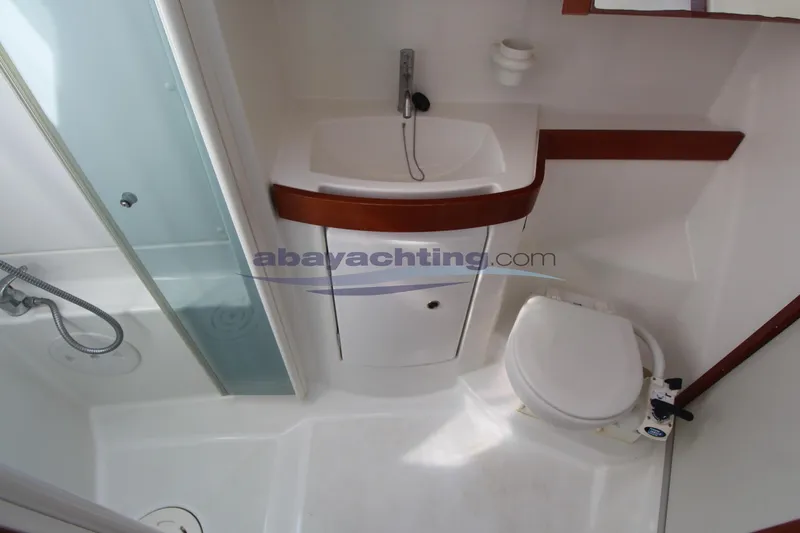  Yacht Photos Pics Bathroom of 2007 Beneteau Oceanis 43 yacht with sink, toilet, and shower.