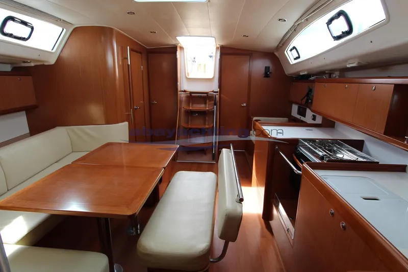  Yacht Photos Pics Interior of 2007 Beneteau Oceanis 43 yacht with wood finish and modern amenities.