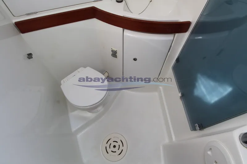  Yacht Photos Pics Bathroom interior of 2007 Beneteau Oceanis 43 yacht, featuring toilet and shower area.