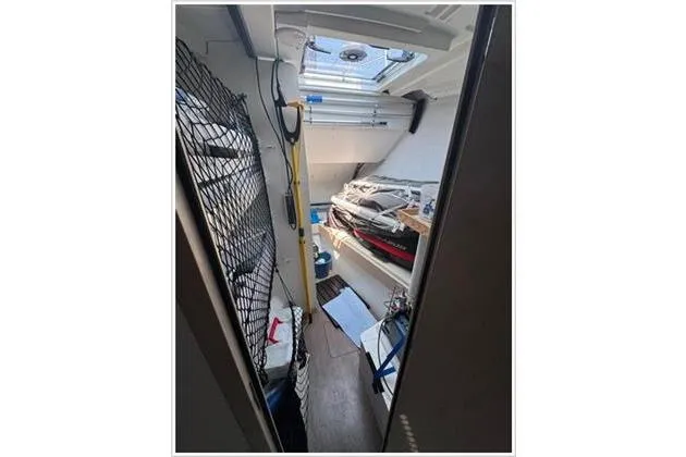  Yacht Photos Pics Interior view of 2021 Jeanneau 60 sailboat, showcasing storage area and equipment.