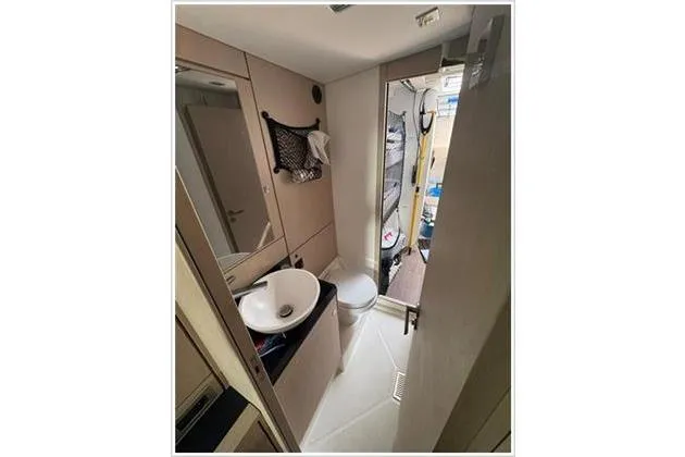  Yacht Photos Pics Bathroom interior of 2021 Jeanneau 60 yacht, featuring sink and toilet.