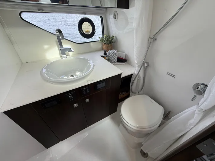 Yacht Photos Pics Luxurious bathroom of 2025 Cruisers Yachts 38 GLS with sink and toilet.