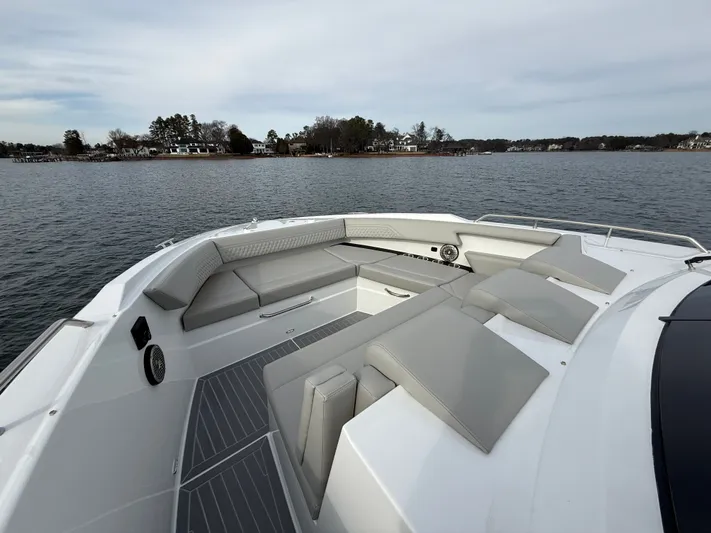  Yacht Photos Pics 2025 Cruisers Yachts 38 GLS with luxurious deck on calm waters.