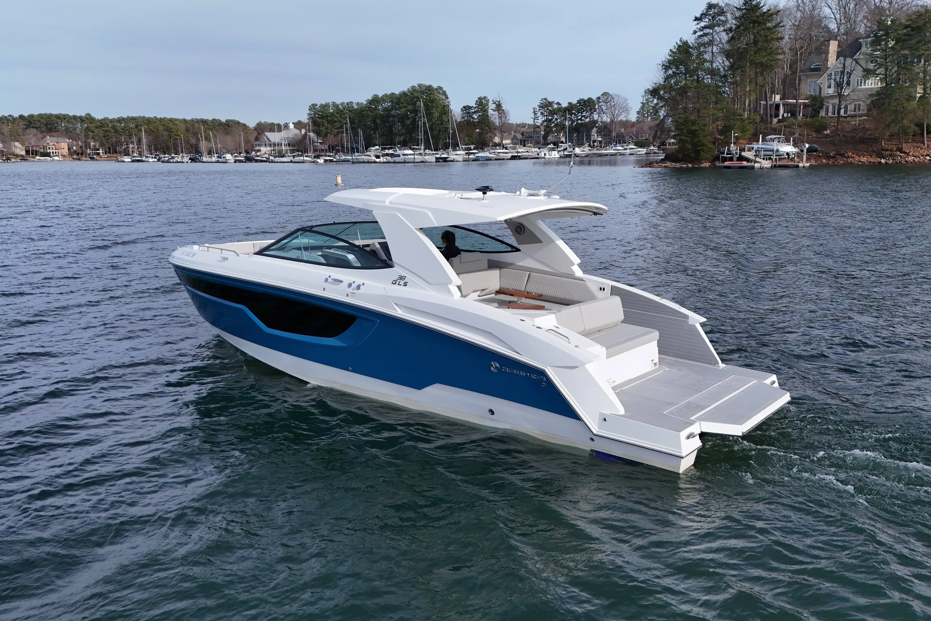  Yacht Photos Pics 2025 Cruisers Yachts 38 GLS on a serene lake.