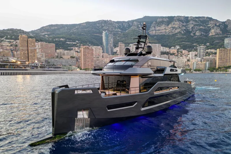  Yacht Photos Pics Luxurious Maori 125 yacht cruising near a coastal cityscape, 2029 model.