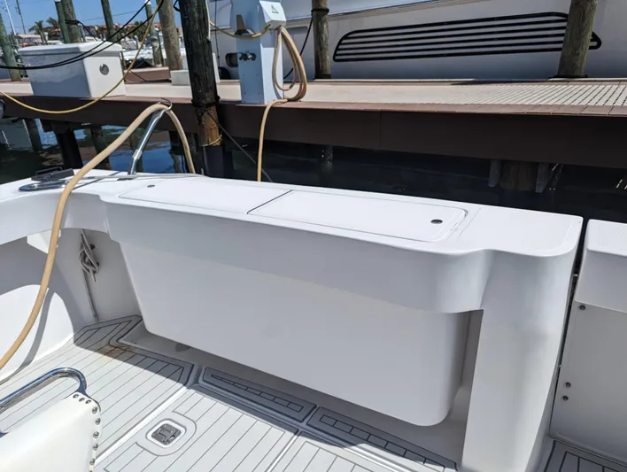 Rubia Yacht Photos Pics Luhrs 36 Convertible 2000 model, docked with clean white deck and storage compartment.