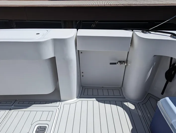 Rubia Yacht Photos Pics Luhrs 36 Convertible 2000 boat deck with storage compartment and clean design.