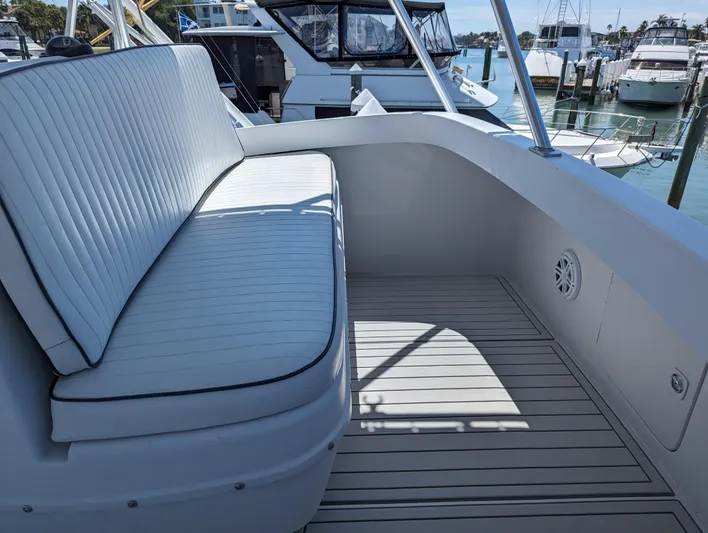 Rubia Yacht Photos Pics Luhrs 36 Convertible 2000 boat deck with cushioned seating and marina view.
