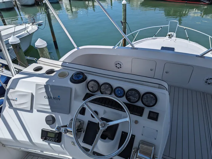 Rubia Yacht Photos Pics Helm of 2000 Luhrs 36 Convertible boat with Garmin navigation system.