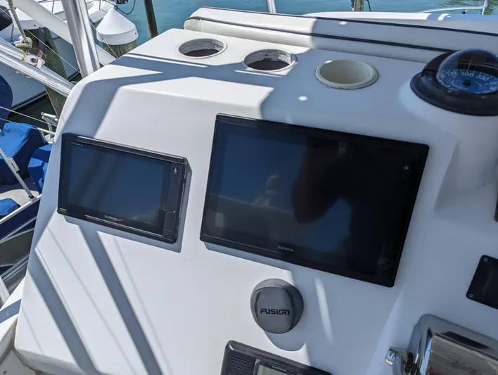 Rubia Yacht Photos Pics Control panel of 2000 Luhrs 36 Convertible boat with navigation screens.