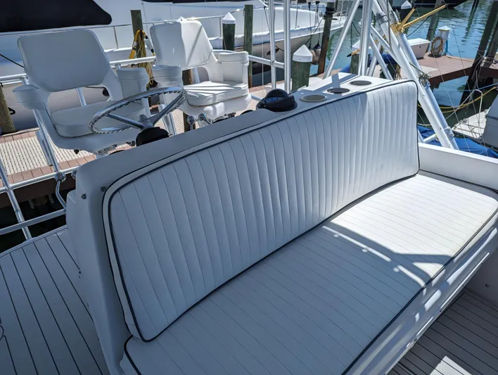 Rubia Yacht Photos Pics Luhrs 36 Convertible 2000 boat with white seating and helm chairs on deck.