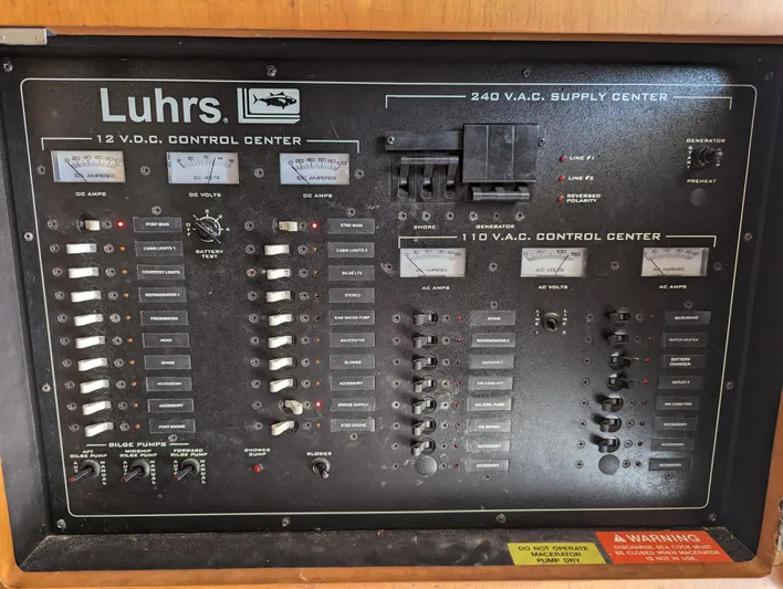 Rubia Yacht Photos Pics Luhrs 36 Convertible 2000 electrical control panel with switches and meters.