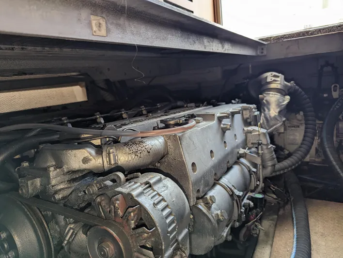 Rubia Yacht Photos Pics Engine compartment of 2000 Luhrs 36 Convertible boat, showcasing detailed mechanical components.