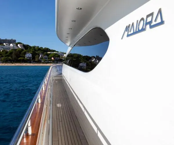  Yacht Photos Pics Luxury Maiora 31DP yacht, 2009 model, cruising near scenic coastline.