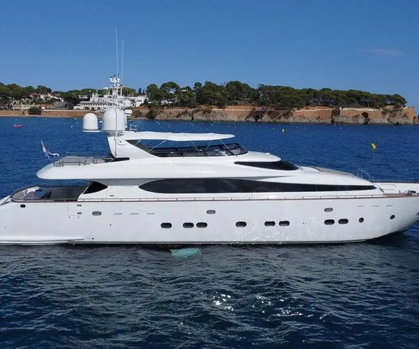  Yacht Photos Pics Luxurious 2009 Maiora 31DP yacht cruising on a serene blue sea.