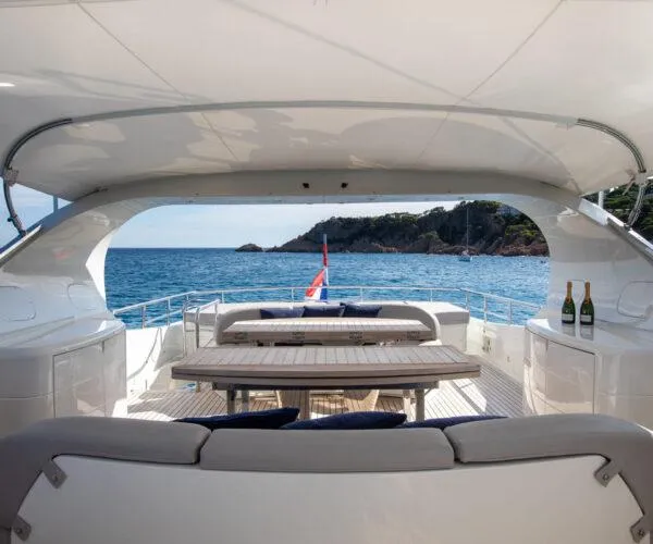  Yacht Photos Pics Luxurious 2009 Maiora 31DP yacht deck with ocean view and seating area.