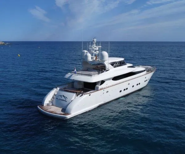  Yacht Photos Pics Luxurious 2009 Maiora 31DP yacht cruising on open sea under clear skies.