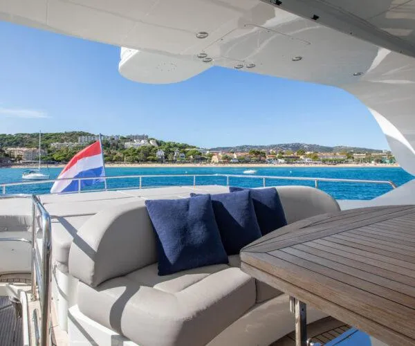  Yacht Photos Pics Luxurious Maiora 31DP yacht deck with seating, table, and scenic ocean view, 2009 model.