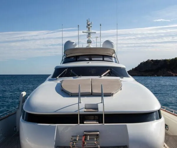  Yacht Photos Pics Luxury Maiora 31DP yacht from 2009 on calm sea with scenic coastline.