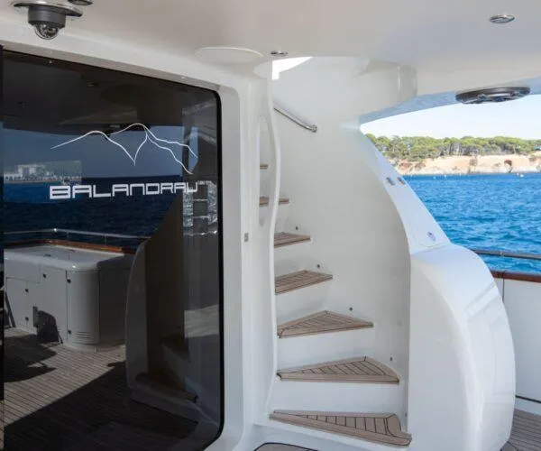  Yacht Photos Pics Luxurious 2009 Maiora 31DP yacht with elegant staircase and ocean view.