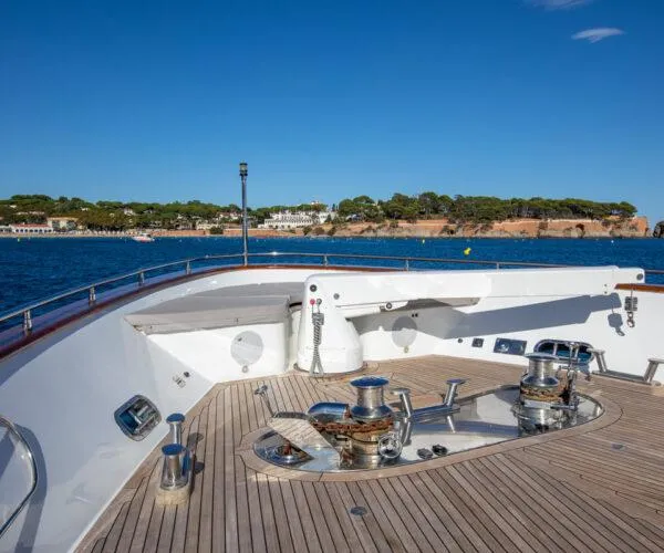  Yacht Photos Pics Bow view of 2009 Maiora 31DP yacht with scenic coastal background.