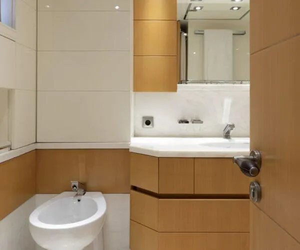  Yacht Photos Pics Luxurious bathroom on a 2009 Maiora 31DP yacht with modern fixtures and wooden cabinetry.