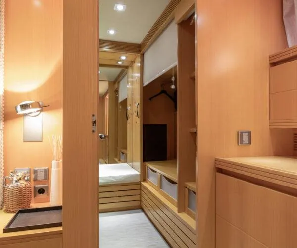  Yacht Photos Pics Luxurious interior of 2009 Maiora 31DP yacht with wooden cabinetry and modern lighting.