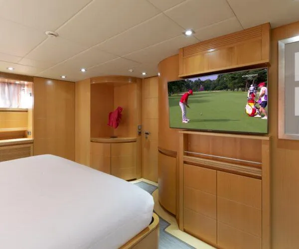  Yacht Photos Pics Luxurious Maiora 31DP yacht bedroom with TV, modern wood paneling, and elegant design, 2009 model.