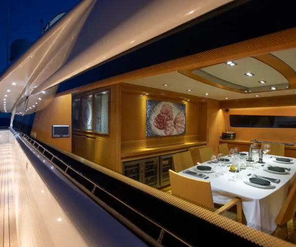  Yacht Photos Pics Luxurious dining area on 2009 Maiora 31DP yacht, elegantly set table, modern interior design.