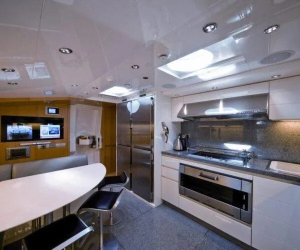  Yacht Photos Pics Luxurious kitchen interior of 2009 Maiora 31DP yacht with modern appliances and sleek design.