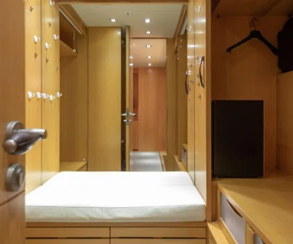  Yacht Photos Pics Luxurious wooden interior of 2009 Maiora 31DP yacht with seating and storage.