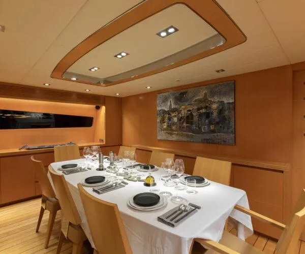  Yacht Photos Pics Luxurious dining area on 2009 Maiora 31DP yacht, featuring elegant table setting and modern decor.
