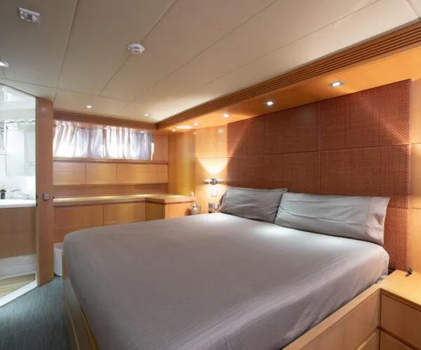  Yacht Photos Pics Luxurious bedroom interior of 2009 Maiora 31DP yacht with modern design and ambient lighting.