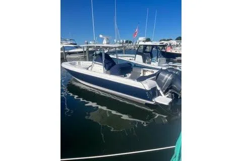  Yacht Photos Pics 2022 Sailfish 320 CC boat docked in marina under clear blue sky.