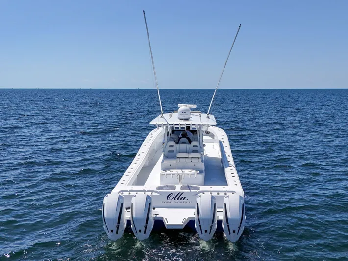  Yacht Photos Pics 2023 Freeman 47 boat on open sea, featuring four powerful engines.